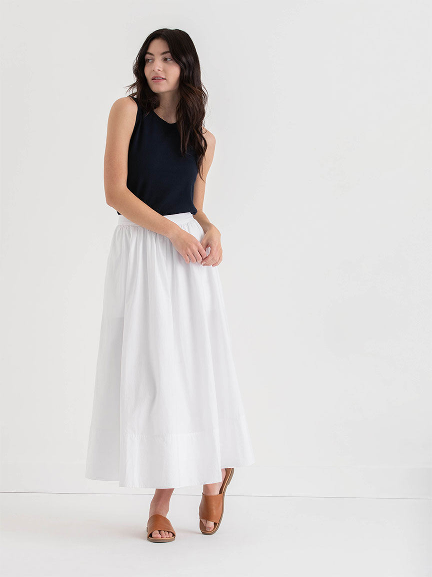 Black top white skirt 2025